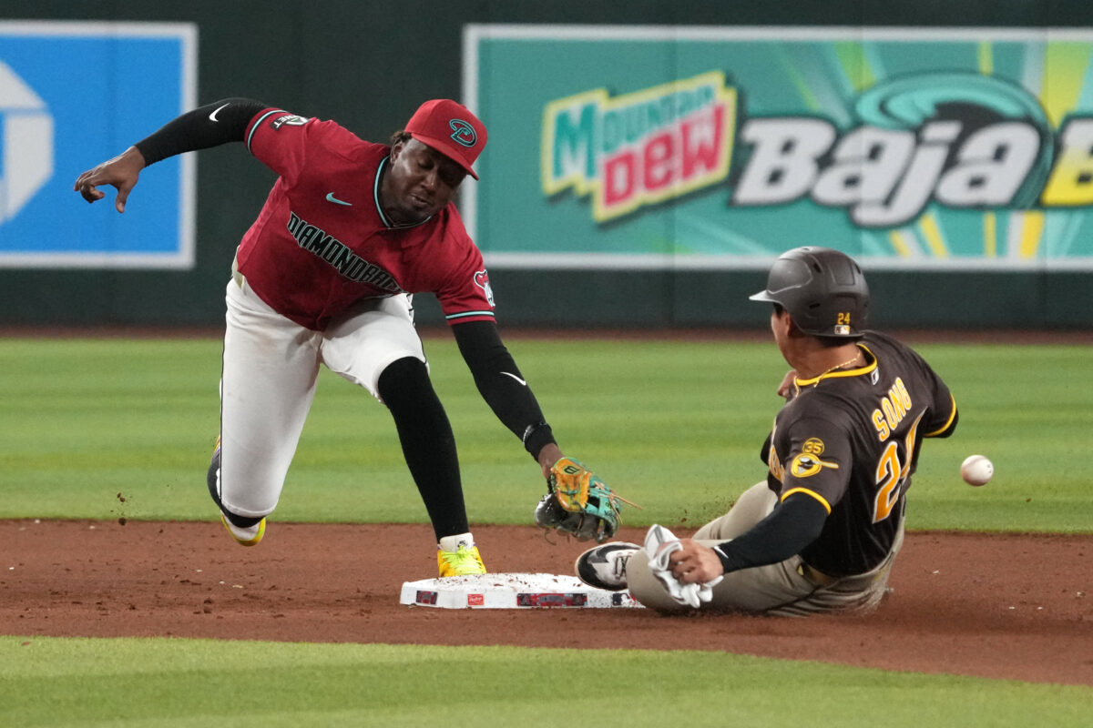 Aug 5, 2026; Phoenix, Arizona, USA; Arizona Diamondbacks shortstop Geraldo Perdomo (2) tries to tag out San Diego Padres second baseman Sung-Mun Song (24) in the ninth inning at Chase Field. Mandatory Credit: Rick Scuteri-Imagn Images