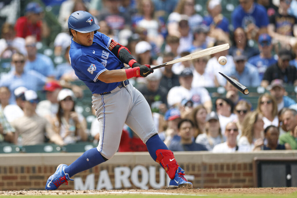 Aug 6, 2026; Chicago, Illinois, USA; Toronto Blue Jays first baseman Kazuma Okamoto (7) singles against the Chicago Cubs as he breaks his bat during the third inning at Wrigley Field. Mandatory Credit: Kamil Krzaczynski-Imagn Images