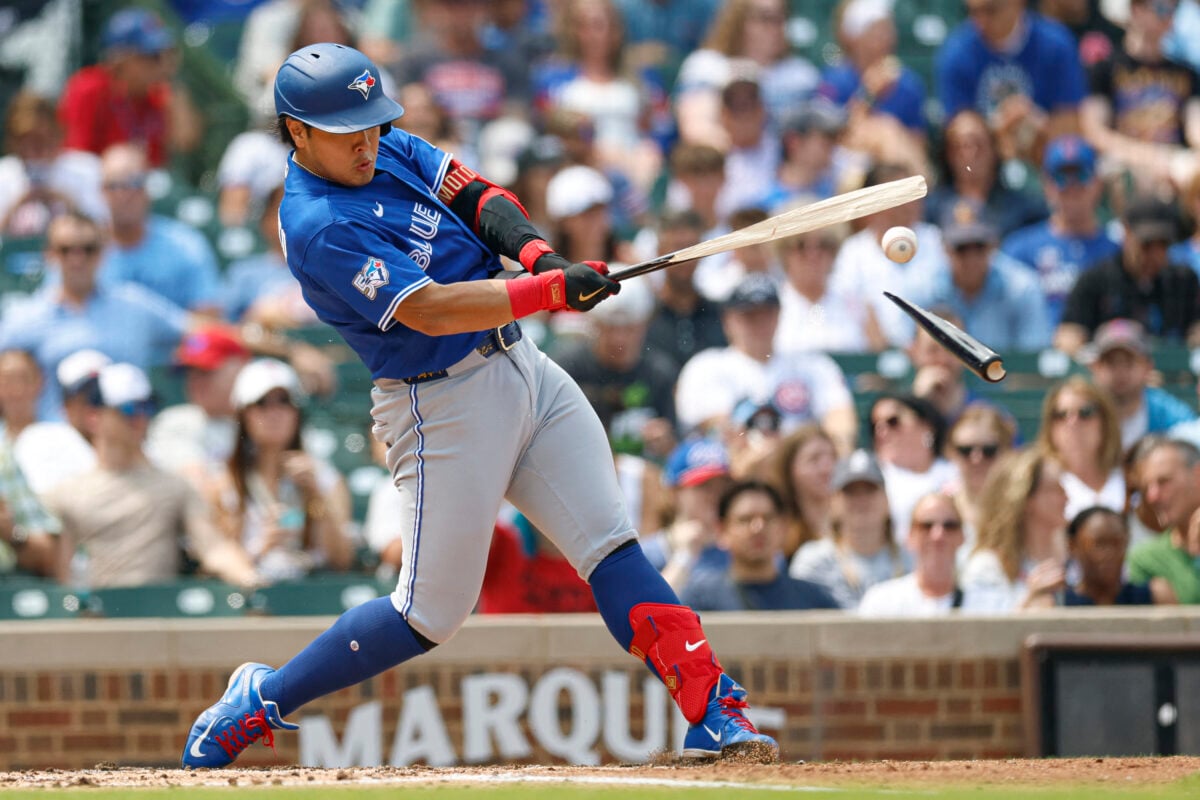 Aug 6, 2026; Chicago, Illinois, USA; Toronto Blue Jays first baseman Kazuma Okamoto (7) singles against the Chicago Cubs as he breaks his bat during the third inning at Wrigley Field. Mandatory Credit: Kamil Krzaczynski-Imagn Images