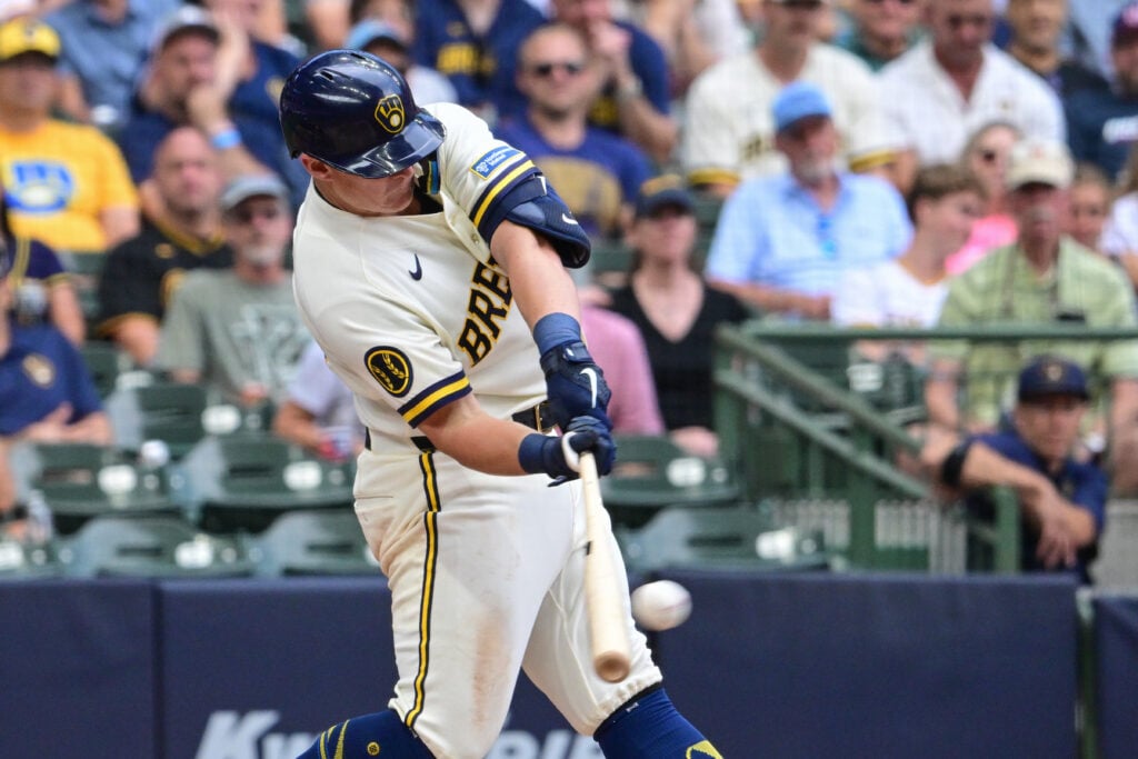 Aug 6, 2026; Milwaukee, Wisconsin, USA; Milwaukee Brewers first baseman Andrew Vaughn (28) drives in a run with a base hit in the fifth inning against the Pittsburgh Pirates at American Family Field. Mandatory Credit: Benny Sieu-Imagn Images