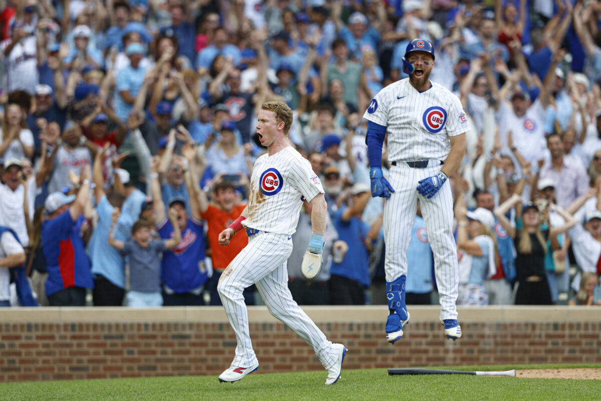 Aug 6, 2026; Chicago, Illinois, USA; Chicago Cubs designated hitter Pete Crow-Armstrong (4) celebrates with first baseman Michael Busch (29) after scoring a game winning run against the Toronto Blue Jays during the 11th inning at Wrigley Field. Mandatory Credit: Kamil Krzaczynski-Imagn Images