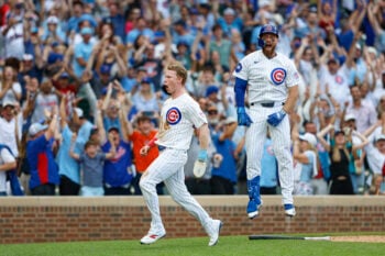 Aug 6, 2026; Chicago, Illinois, USA; Chicago Cubs designated hitter Pete Crow-Armstrong (4) celebrates with first baseman Michael Busch (29) after scoring a game winning run against the Toronto Blue Jays during the 11th inning at Wrigley Field. Mandatory Credit: Kamil Krzaczynski-Imagn Images