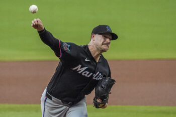 Aug 6, 2026; Cumberland, Georgia, USA; Miami Marlins pitcher Janson Junk (26) pitches against the Atlanta Braves during the first inning at Truist Park. Mandatory Credit: Dale Zanine-Imagn Images