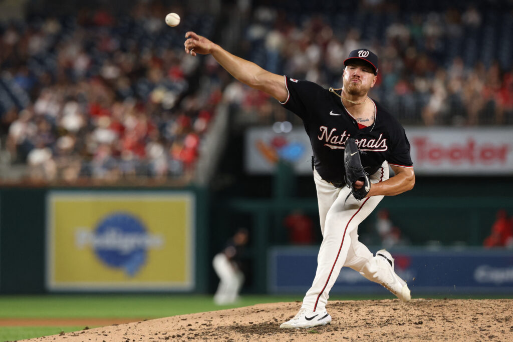 Aug 7, 2026; Washington, District of Columbia, USA; Washington Nationals pitcher Cade Cavalli (24) pitches against the Cincinnati Reds during the sixth inning at Nationals Park. Mandatory Credit: Geoff Burke-Imagn Images