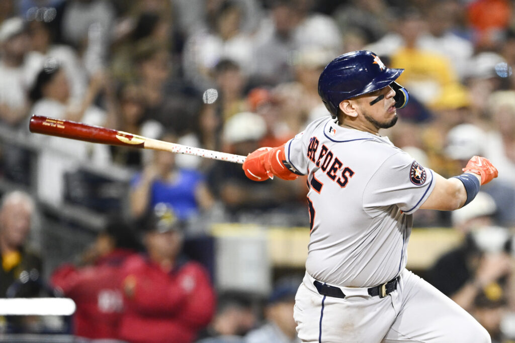 Aug 7, 2026; San Diego, California, USA; Houston Astros third baseman Isaac Paredes (15) hits a single during the ninth inning against the San Diego Padres at Petco Park. Mandatory Credit: Denis Poroy-Imagn Images