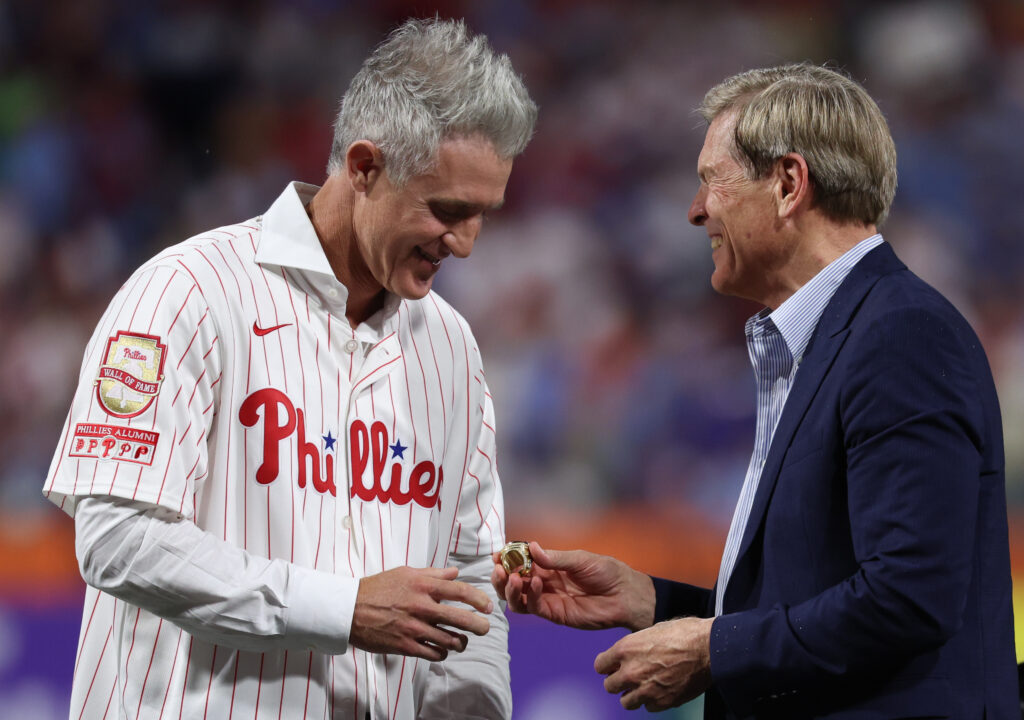 Aug 7, 2026; Philadelphia, Pennsylvania, USA; Philadelphia Phillies Chase Utley is presented a ring by owner John Middleton during a ceremony to induct him into the teams Wall of Fame before a game against the Toronto Blue Jays at Citizens Bank Park. Mandatory Credit: Bill Streicher-Imagn Images