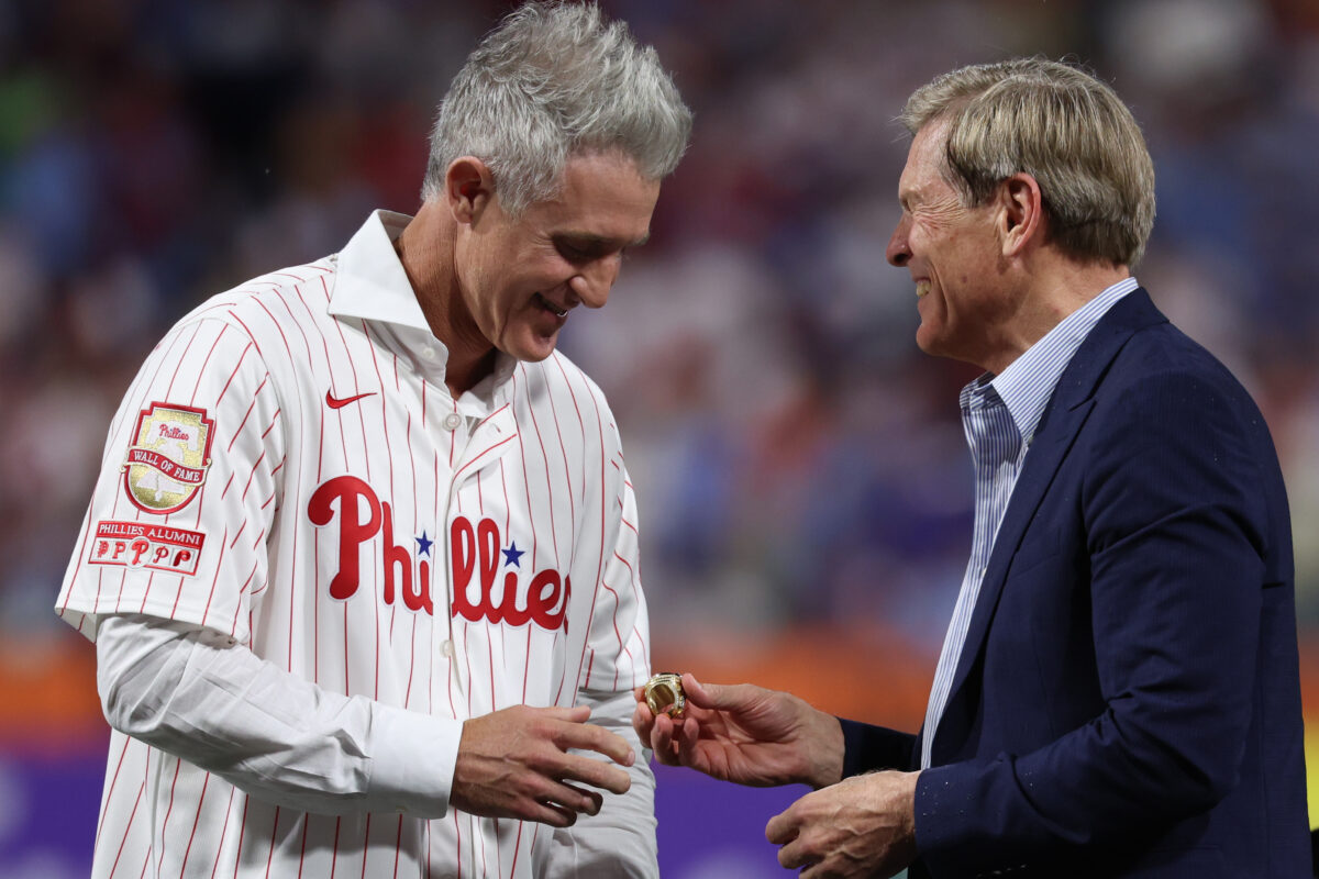 Aug 7, 2026; Philadelphia, Pennsylvania, USA; Philadelphia Phillies Chase Utley is presented a ring by owner John Middleton during a ceremony to induct him into the teams Wall of Fame before a game against the Toronto Blue Jays at Citizens Bank Park. Mandatory Credit: Bill Streicher-Imagn Images