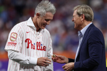 Aug 7, 2026; Philadelphia, Pennsylvania, USA; Philadelphia Phillies Chase Utley is presented a ring by owner John Middleton during a ceremony to induct him into the teams Wall of Fame before a game against the Toronto Blue Jays at Citizens Bank Park. Mandatory Credit: Bill Streicher-Imagn Images