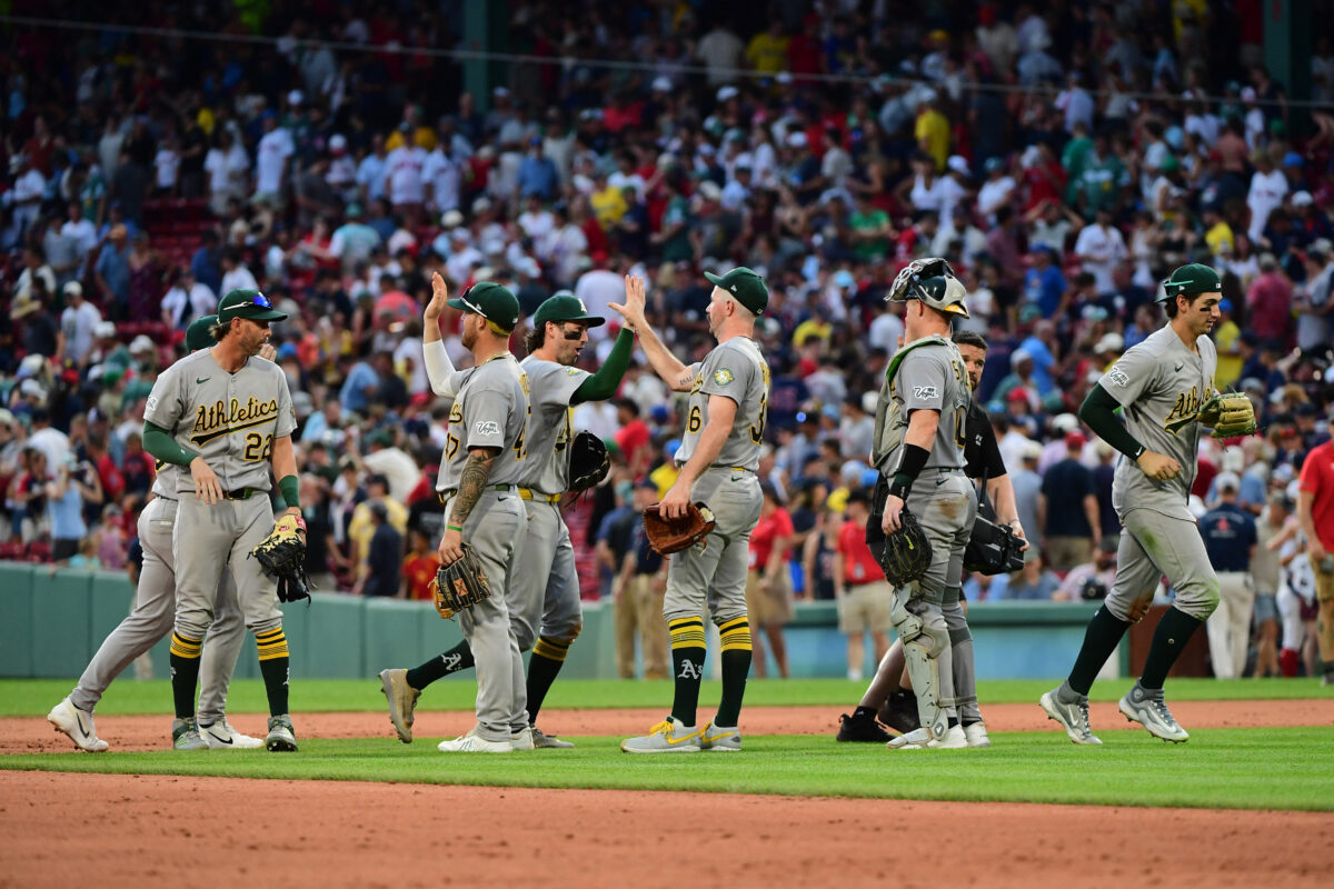 Aug 8, 2026; Boston, Massachusetts, USA; The Athletics celebrate after defeating the Boston Red Sox at Fenway Park. Mandatory Credit: Bob DeChiara-Imagn Images