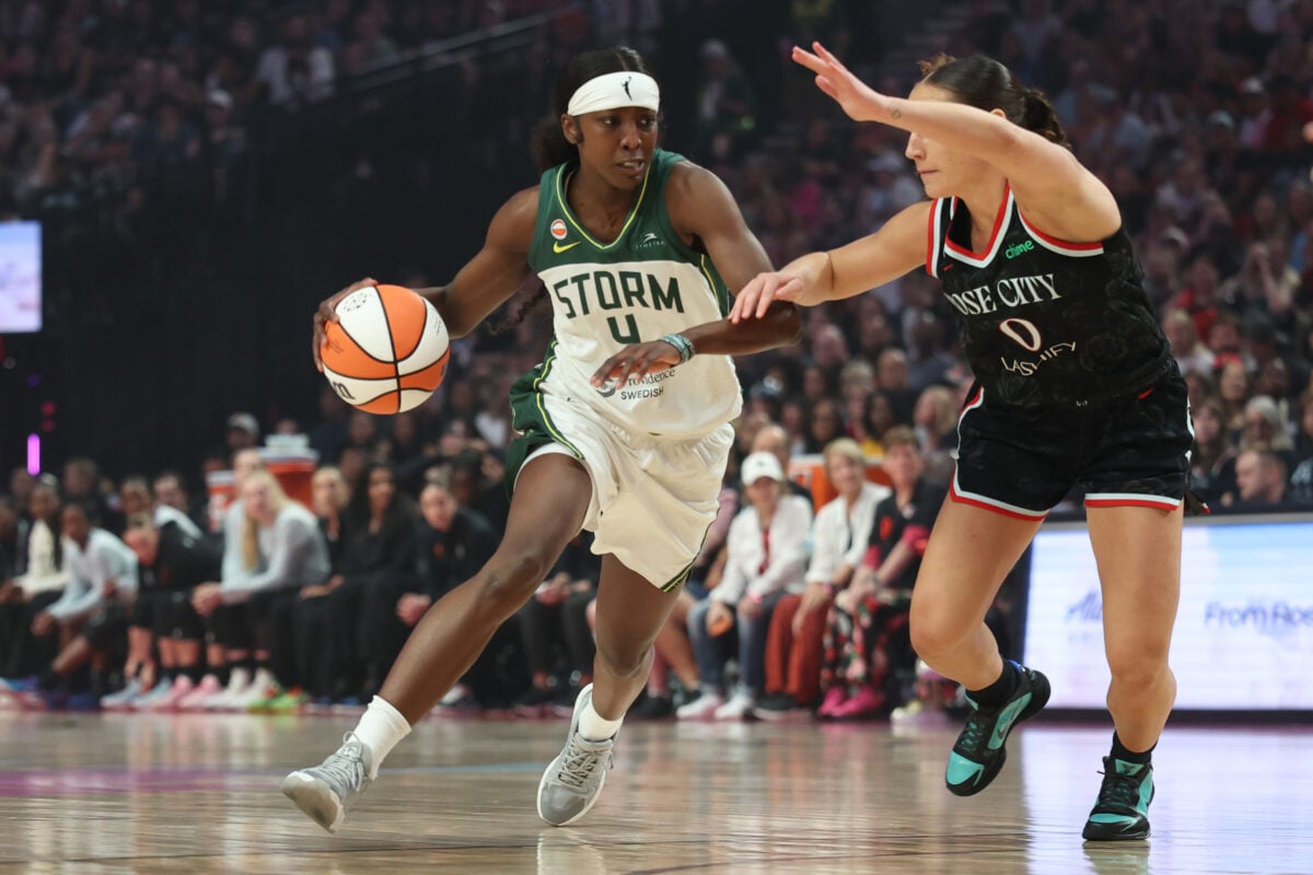Aug 8, 2026; Portland, Oregon, USA;  Seattle Storm guard Flau'jae Johnson (4) drives to the basket against Portland Fire guard Carla Leite (0) during the first half at Moda Center. Mandatory Credit: Jaime Valdez-Imagn Images