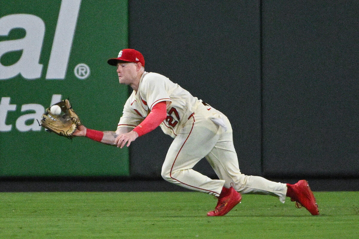 Aug 8, 2026; St. Louis, Missouri, USA; St. Louis Cardinals center fielder Nathan Church (27) dives and catches a line drive hit by Colorado Rockies right fielder Jordan Beck (not pictured) during the eighth inning at Busch Stadium. Mandatory Credit: Jeff Curry-Imagn Images