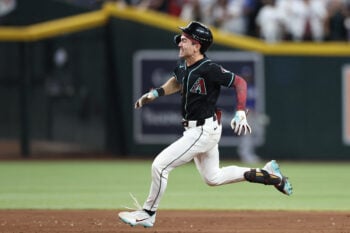 Aug 8, 2026; Phoenix, Arizona, USA; Arizona Diamondbacks right fielder Corbin Carroll (7) runs after hitting an RBI triple against the Los Angeles Dodgers in the ninth inning at Chase Field. Mandatory Credit: Anna Carrington-Imagn Images