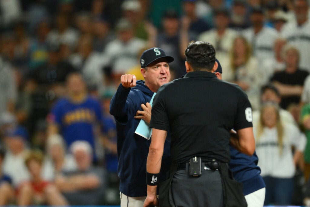 Aug 8, 2026; Seattle, Washington, USA; Seattle Mariners manager Dan Wilson (6) interacts with home plate umpire umpire Emil Jimenez (82) after being ejected during the sixth inning against the Tampa Bay Rays at T-Mobile Park. Mandatory Credit: Steven Bisig-Imagn Images