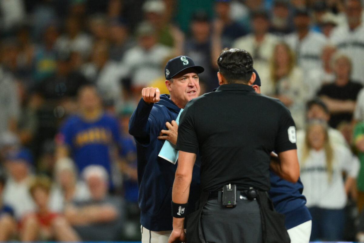 Aug 8, 2026; Seattle, Washington, USA; Seattle Mariners manager Dan Wilson (6) interacts with home plate umpire umpire Emil Jimenez (82) after being ejected during the sixth inning against the Tampa Bay Rays at T-Mobile Park. Mandatory Credit: Steven Bisig-Imagn Images