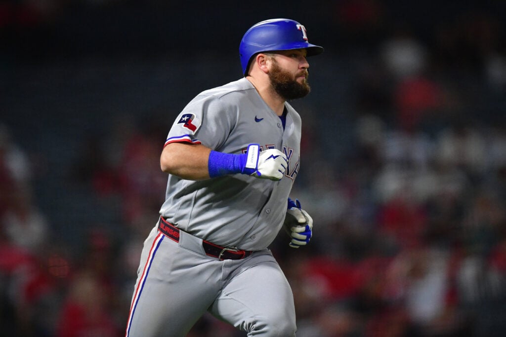 Aug 10, 2026; Anaheim, California, USA; Texas Rangers first baseman Jake Burger (21) runs after hitting a two run RBI single against the Los Angeles Angels during the tenth inning at Angel Stadium. Mandatory Credit: Gary A. Vasquez-Imagn Images