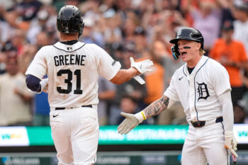 Detroit Tigers left fielder Riley Greene (31) high-fives center fielder Max Clark (15) after scoring a run against Cleveland Guardians during the second inning at Comerica Park in Detroit on Tuesday, August 11, 2026.