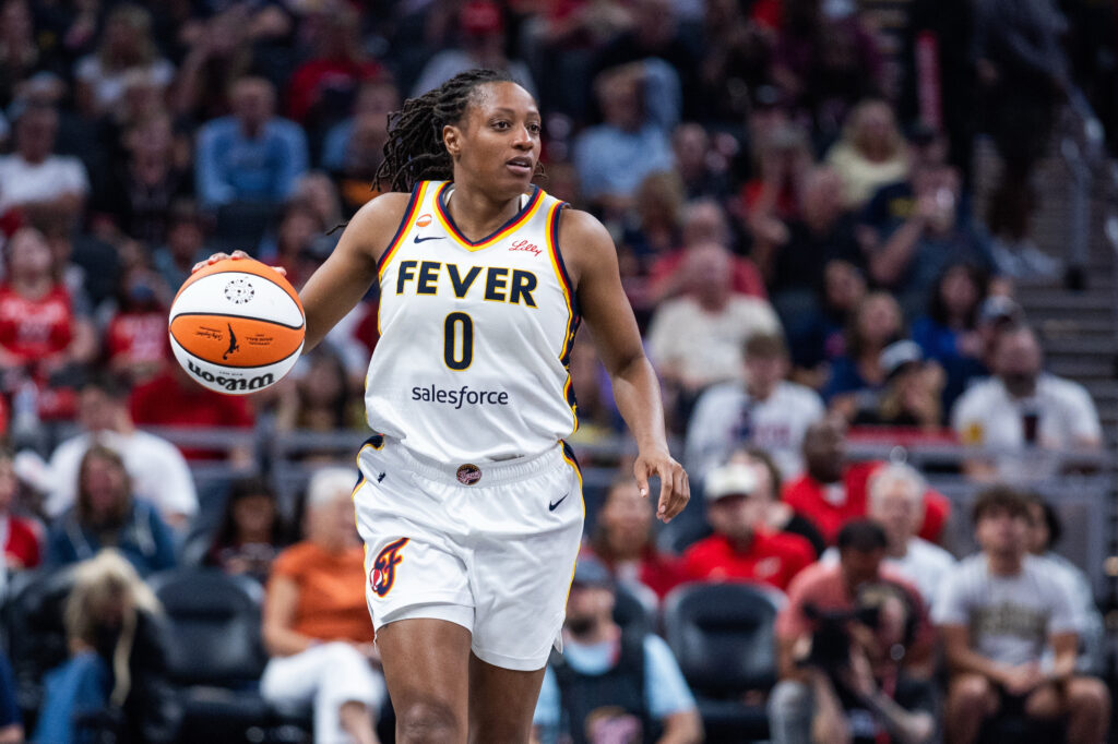 Aug 11, 2026; Indianapolis, Indiana, USA;  Indiana Fever guard Kelsey Mitchell (0) dribbles the ball  in the second half against the New York Liberty at Gainbridge Fieldhouse. Mandatory Credit: Trevor Ruszkowski-Imagn Images