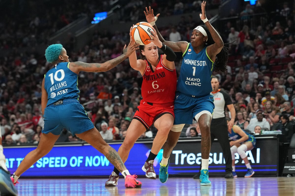 Aug 12, 2026; Portland, Oregon, USA; Portland Fire forward Bridget Carleton (6) drives to the basket between Minnesota Lynx guard Courtney Williams (10) and forward Natasha Howard (1) during the second half at Moda Center. Mandatory Credit: Soobum Im-Imagn Images