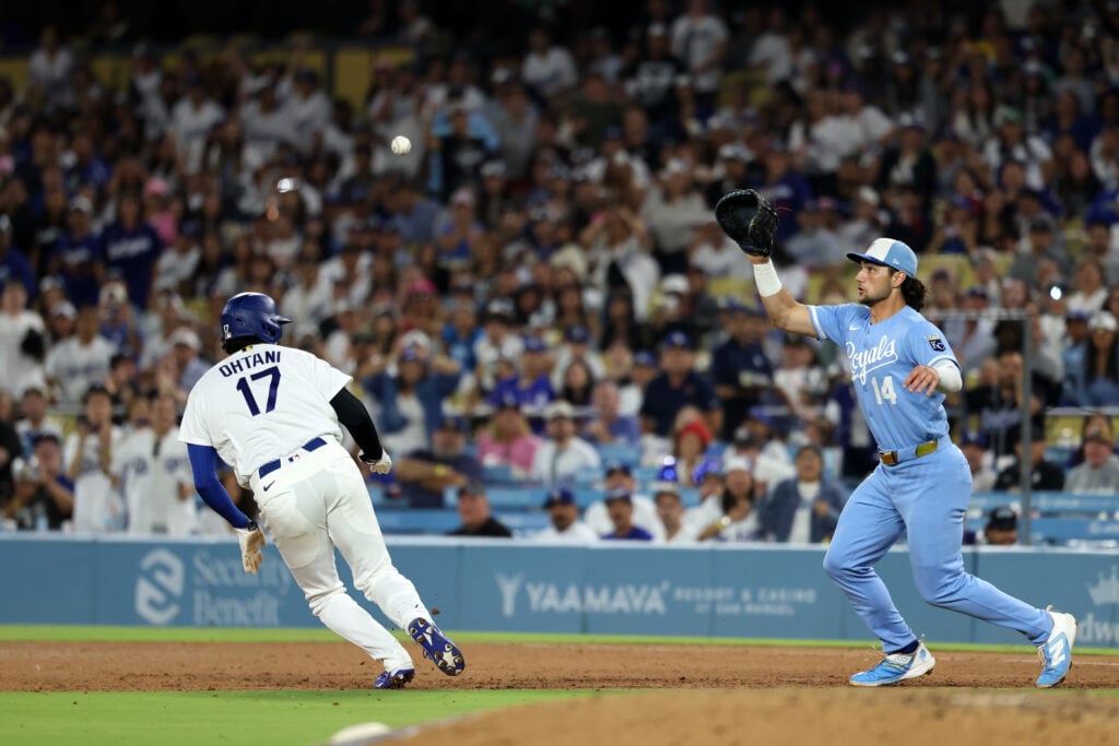 Aug 12, 2026; Los Angeles, California, USA;  Los Angeles Dodgers designated hitter Shohei Ohtani (17) is caught in a run down between first and second by Kansas City Royals first baseman Jac Caglianone (14) during the seventh inning at Dodger Stadium. Mandatory Credit: Kiyoshi Mio-Imagn Images