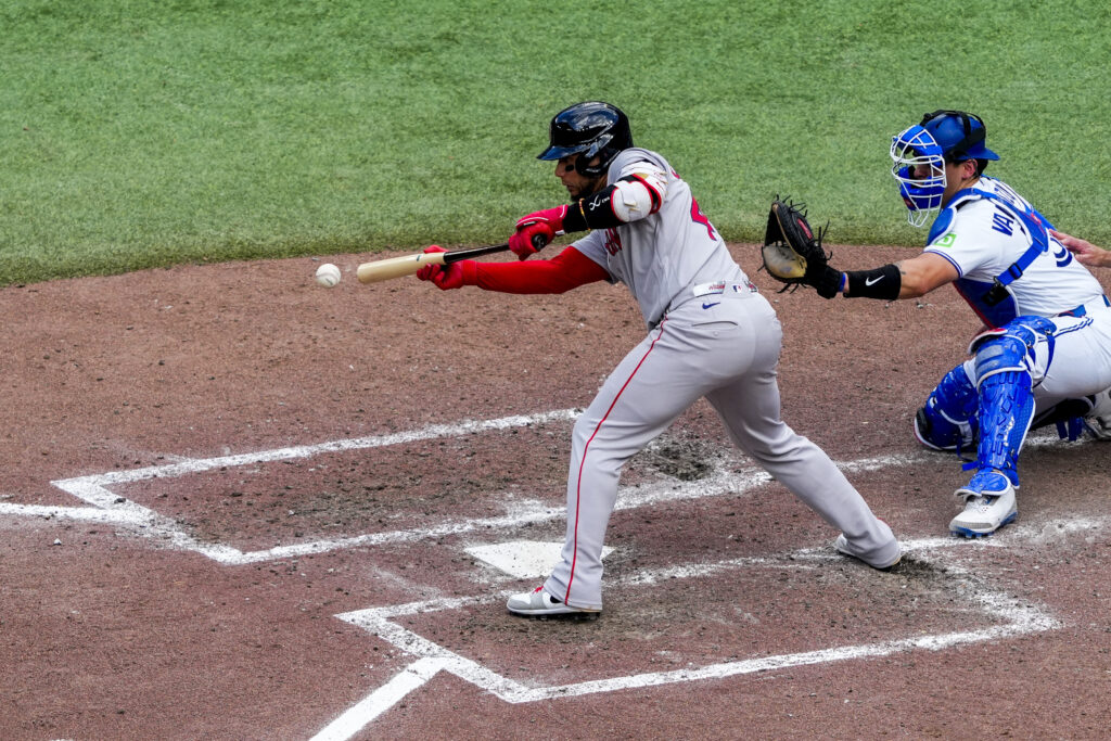 Aug 13, 2026; Toronto, Ontario, CAN; Boston Red Sox first baseman Willson Contreras (40) bunts against the Toronto Blue Jays during the eighth inning at Rogers Centre. Mandatory Credit: Kevin Sousa-Imagn Images