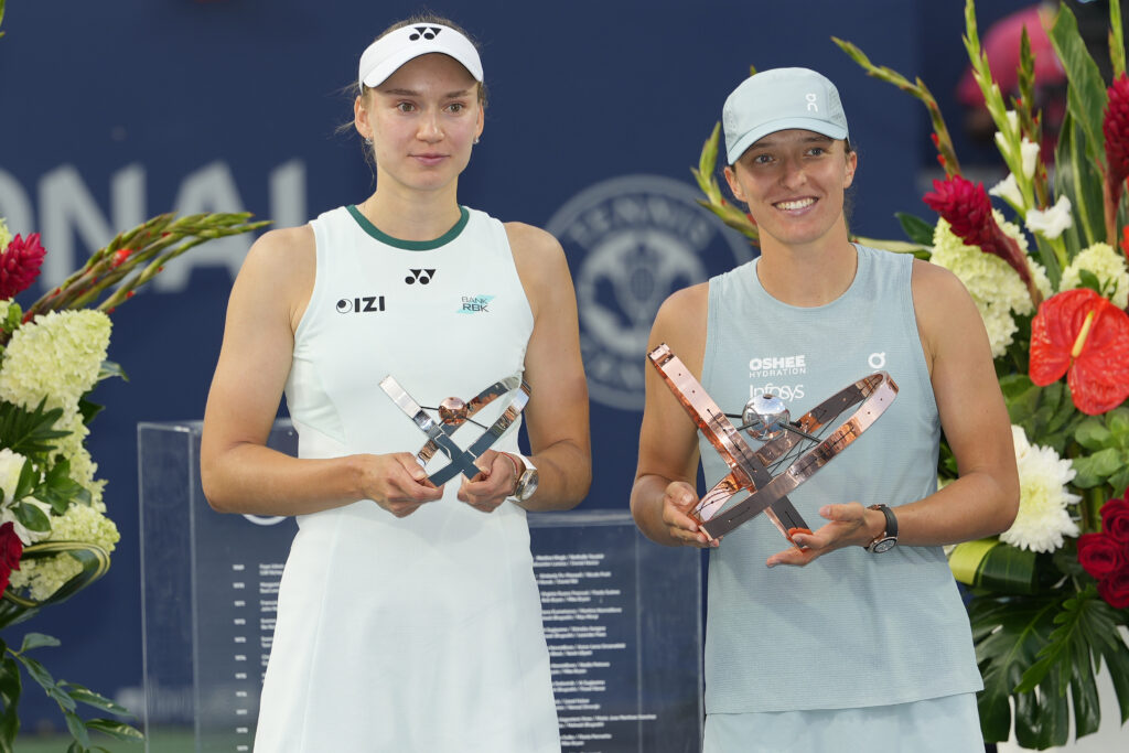 Aug 13, 2026; Toronto, Ontario, Canada; Iga Swiatek (POL) (right) poses with the the National Bank Open trophy with Elena Rybakina (KAZ) (left) after the National Bank Open final at Sobeys Stadium. Mandatory Credit: John E. Sokolowski-Imagn Images