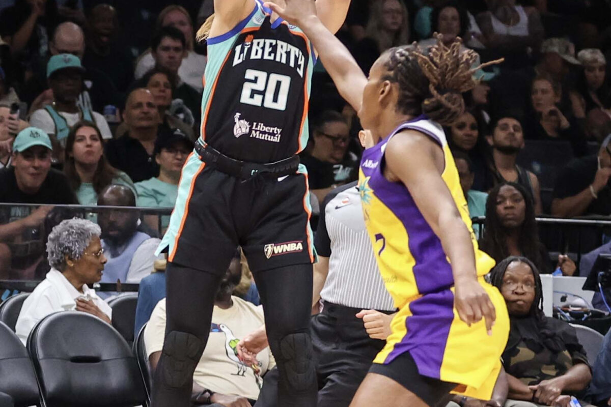 Aug 13, 2026; Brooklyn, New York, USA;  New York Liberty guard Sabrina Ionescu (20) shoots past Los Angeles Sparks guard Ariel Atkins (7) in the third quarter at Barclays Center. Mandatory Credit: Wendell Cruz-Imagn Images
