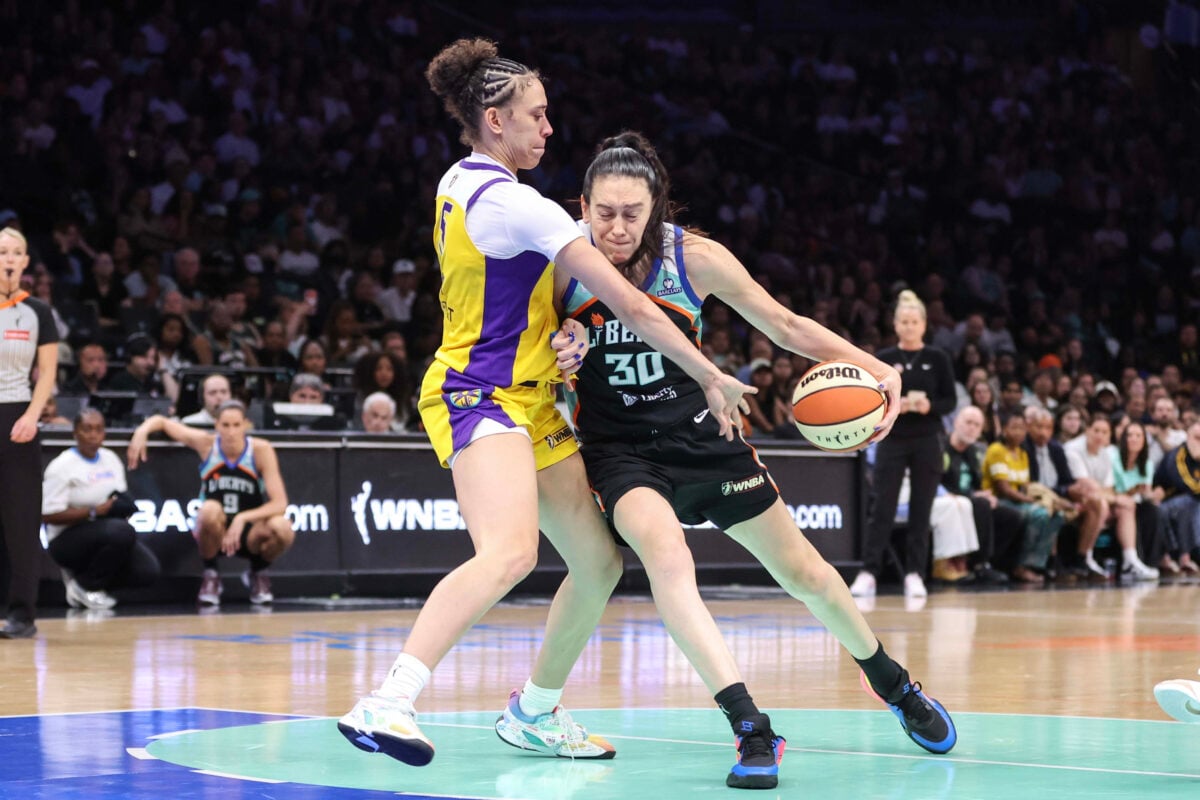 Aug 13, 2026; Brooklyn, New York, USA;  New York Liberty forward Breanna Stewart (30) drives past Los Angeles Sparks forward Dearica Hamby (5) in the fourth quarter at Barclays Center. Mandatory Credit: Wendell Cruz-Imagn Images