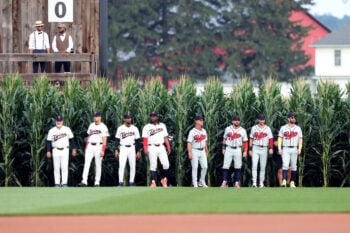 Aug 13, 2026; Dyersville, Iowa, USA;  Members of the Minnesota Twins and Philadelphia Phillies walk out of the corn at the Field of Dreams. Mandatory Credit: Reese Strickland-Imagn Images     TPX IMAGES OF THE DAY