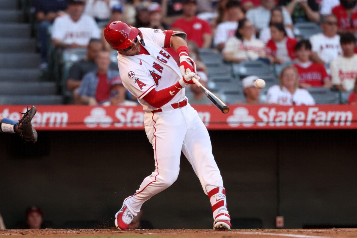 Aug 15, 2026; Anaheim, California, USA;  Los Angeles Angels center fielder Mike Trout (27) hits a single during the first inning against the Kansas City Royals at Angel Stadium. Mandatory Credit: Kiyoshi Mio-Imagn Images