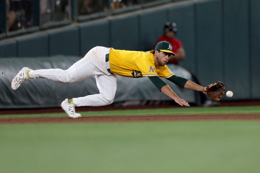Aug 15, 2026; West Sacramento, California, USA; Athletics third baseman Max Muncy (3) dives for the ball hit by Texas Rangers left fielder Wyatt Langford (not pictured) during the eighth inning at Sutter Health Park. Mandatory Credit: Dennis Lee-Imagn Images