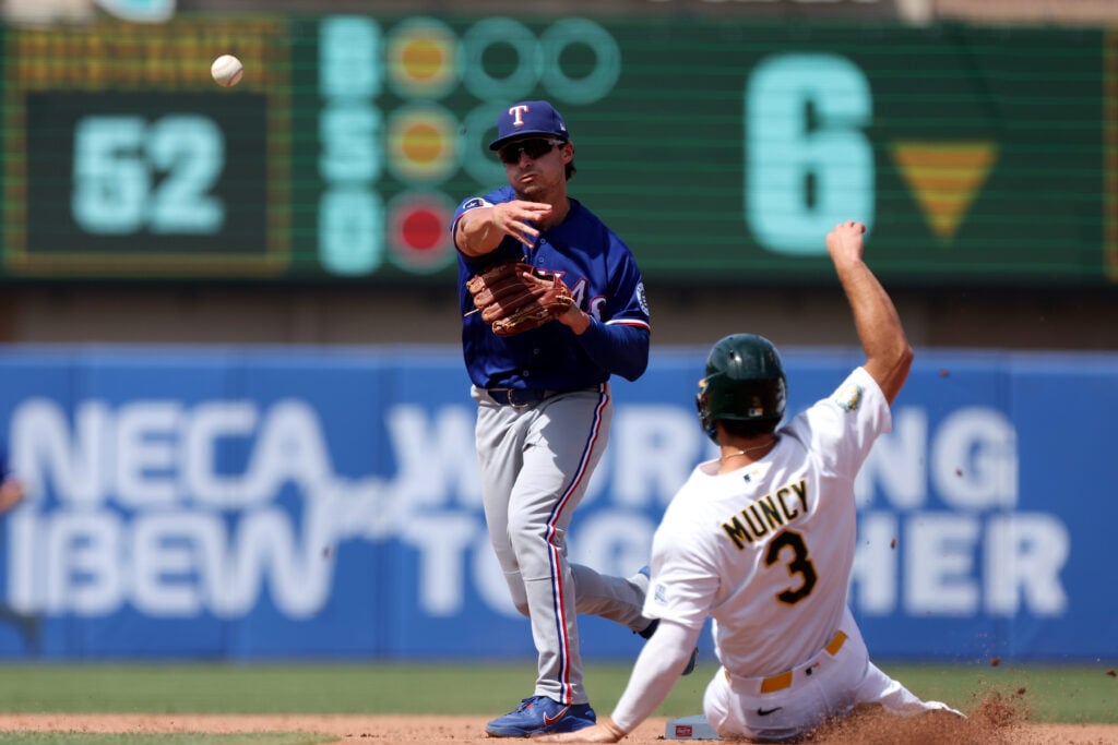 Aug 16, 2026; West Sacramento, California, USA; Texas Rangers second baseman Justin Foscue (14) completes a double play against the Athletics during the sixth inning at Sutter Health Park. Mandatory Credit: Dennis Lee-Imagn Images