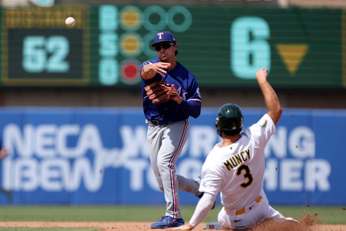 Aug 16, 2026; West Sacramento, California, USA; Texas Rangers second baseman Justin Foscue (14) completes a double play against the Athletics during the sixth inning at Sutter Health Park. Mandatory Credit: Dennis Lee-Imagn Images