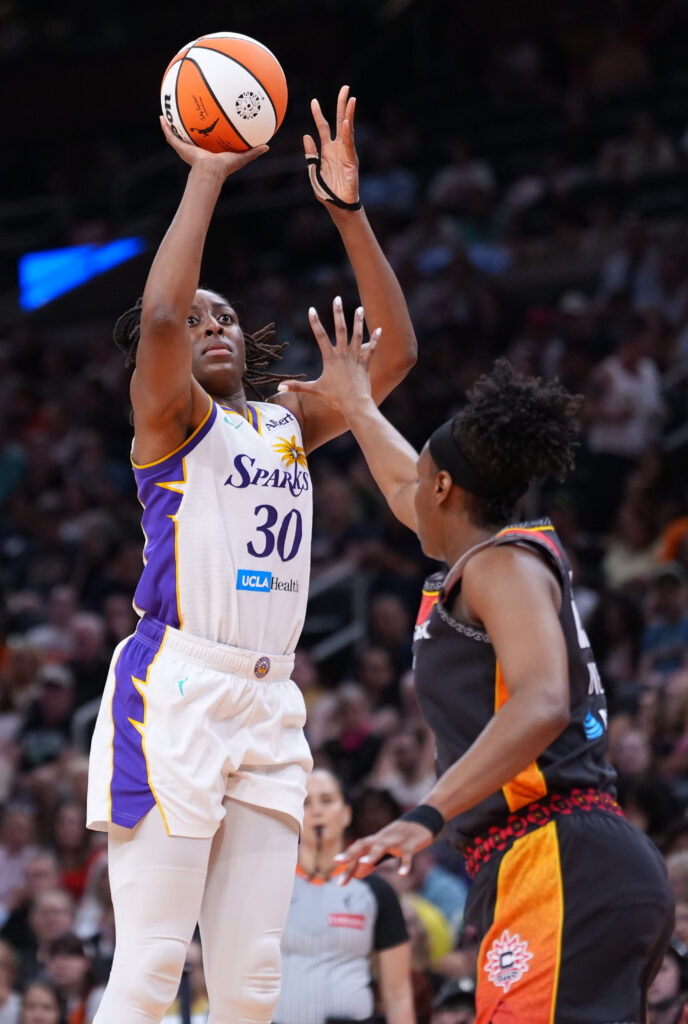 Aug 18, 2026; Boston, Massachusetts, USA; Los Angeles Sparks forward Nneka Ogwumike (30) shoots the ball against Connecticut Sun guard Kennedy Burke (25) in the second half at TD Garden. Mandatory Credit: David Butler II-Imagn Images