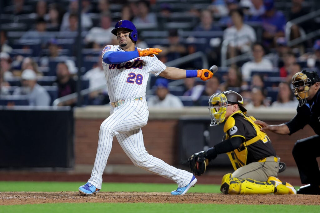 Aug 18, 2026; New York City, New York, USA; New York Mets first baseman Christopher Morel (28) follows through on a single against the San Diego Padres during the eighth inning at Citi Field. Mandatory Credit: Brad Penner-Imagn Images