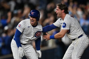 Aug 18, 2026; Chicago, Illinois, USA; Chicago Cubs third baseman Alex Bregman (3) celerates with shortstop Nico Hoerner (2) after hitting a walk-off RBI single against the Chicago White Sox during the ninth inning at Wrigley Field. Mandatory Credit: Patrick Gorski-Imagn Images