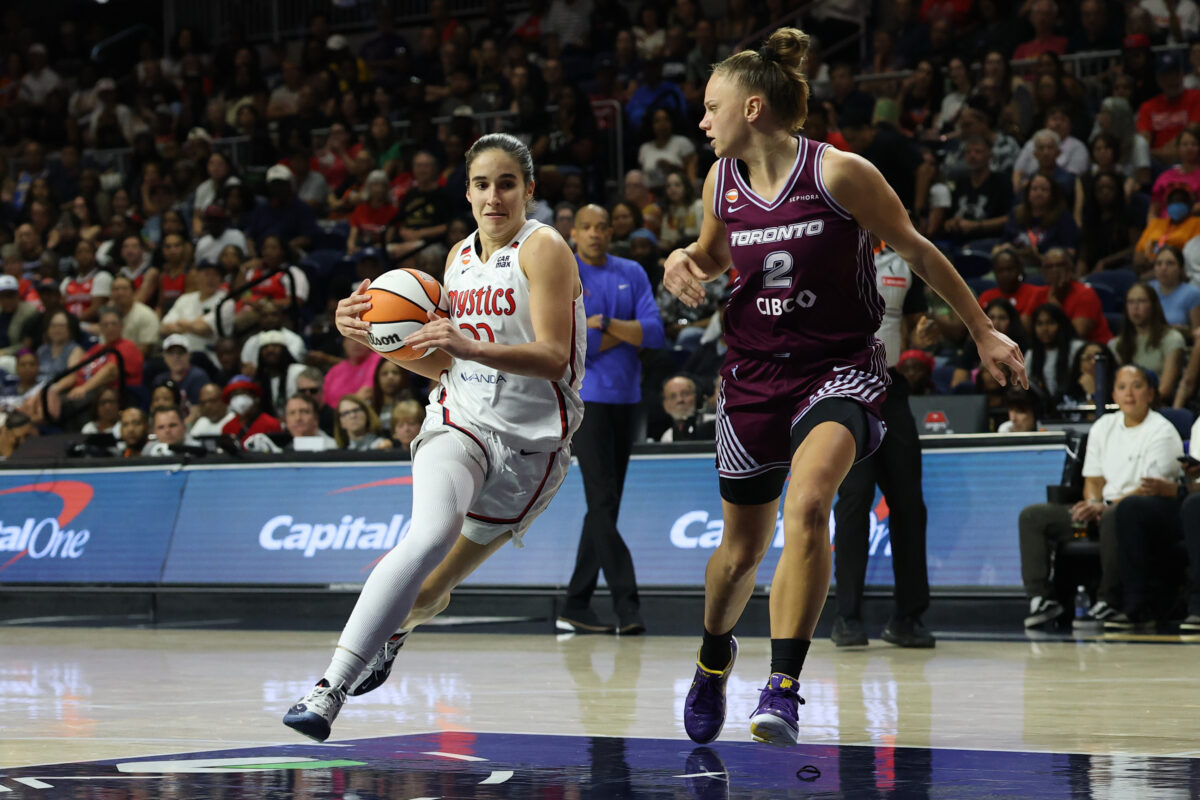 Aug 19, 2026; Washington, District of Columbia, USA; Washington Mystics guard Sonia Citron (22) drives to the basket as Toronto Tempo forward Laura Juskaite (2) defends in the second half at CareFirst Arena. Mandatory Credit: Geoff Burke-Imagn Images
