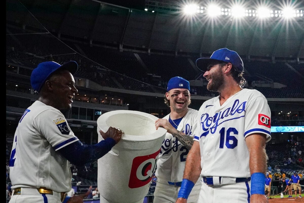 Aug 19, 2026; Kansas City, Missouri, USA; Kansas City Royals right fielder John Rave (16) is doused by left fielder Tyler Tolbert (2) and catcher Carter Jensen (22) after the win over the Athletics at Kauffman Stadium. Mandatory Credit: Denny Medley-Imagn Images