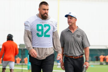 Aug 20, 2026; Miami Gardens, FL, USA; New York Giants head coach John Harbaugh speaks to Miami Dolphins defensive tackle Zach Sieler (92) after joint practice at Baptist Health Training Complex. Mandatory Credit: Sam Navarro-Imagn Images