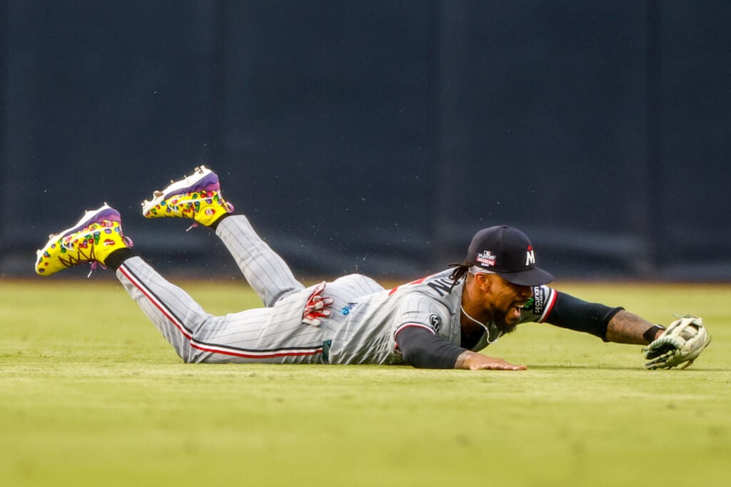 Aug 21, 2026; San Diego, California, USA;  Minnesota Twins center fielder Byron Buxton (25) makes a diving catch during the second inning against the San Diego Padres at Petco Park.  Mandatory Credit: David Frerker-Imagn Images