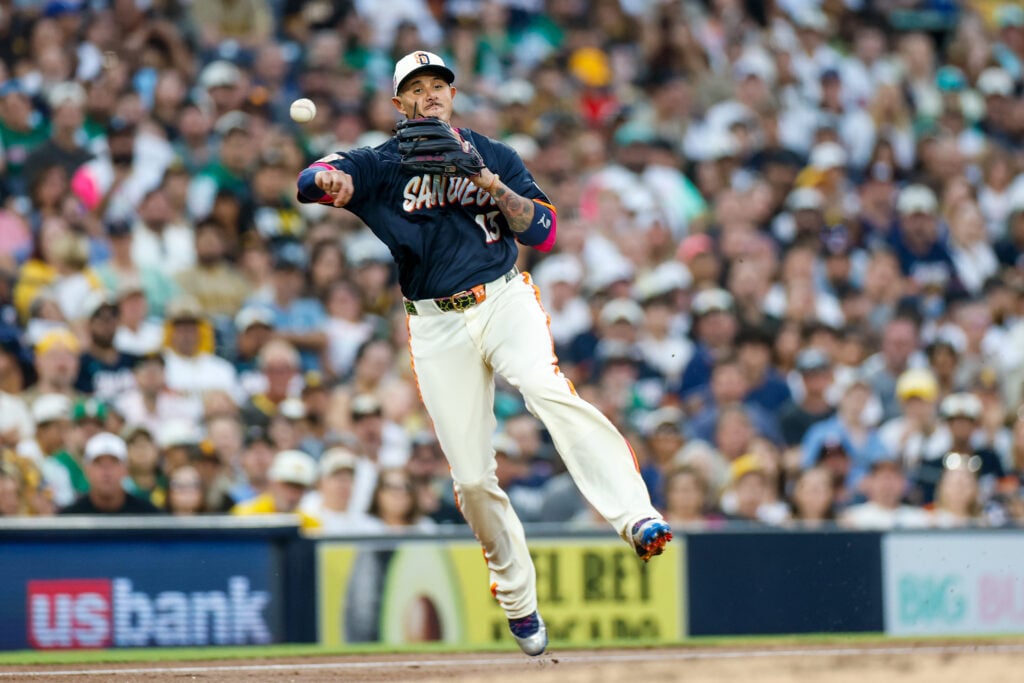 Aug 21, 2026; San Diego, California, USA;  San Diego Padres third baseman Manny Machado (13) throws to first base for a out during the third inning against the Minnesota Twins at Petco Park.  Mandatory Credit: David Frerker-Imagn Images