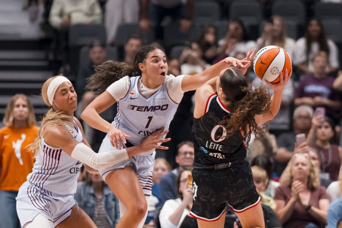 Aug 21, 2026; Vancouver, British Columbia, CAN;  Toronto Tempo forward Isabelle Harrison (21) and center Temi Fagbenle (14) watch as guard Kiki Rice (1) blocks a shot taken by Portland Fire guard Carla Leite (0) in the second half at Rogers Arena.  Mandatory Credit: Bob Frid-Imagn Images