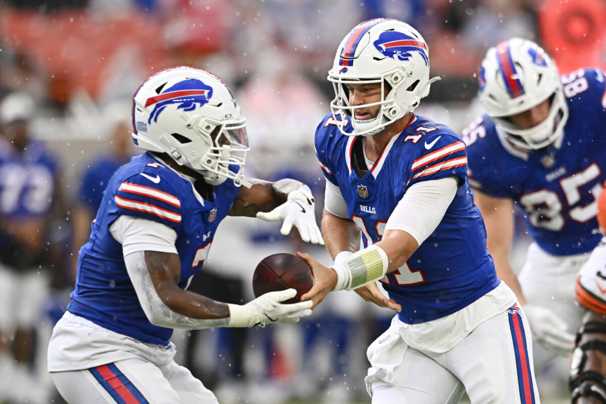 Aug 22, 2026; Cleveland, Ohio, USA; Buffalo Bills quarterback Kyle Allen (11) hands off to running back Ray Davis (7) during the first quarter against the Cleveland Browns at Huntington Bank Field. Mandatory Credit: Ken Blaze-Imagn Images