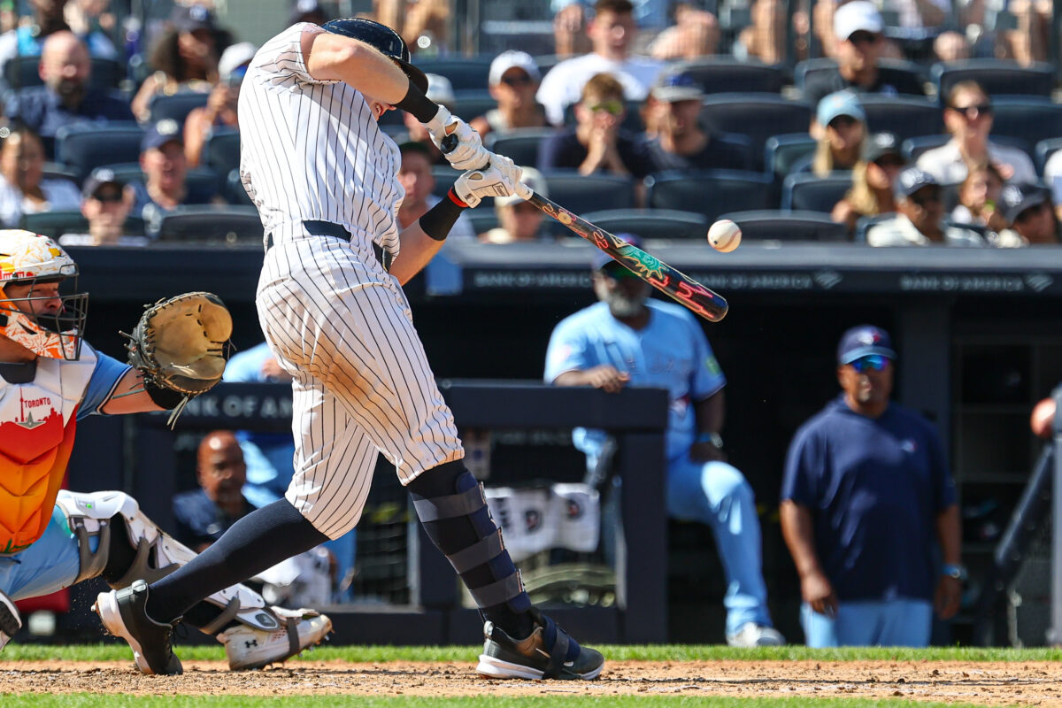 Aug 23, 2026; Bronx, New York, USA; New York Yankees first baseman Ben Rice (22) hits a two-run single during the sixth inning against the Toronto Blue Jays at Yankee Stadium. Mandatory Credit: Vincent Carchietta-Imagn Images