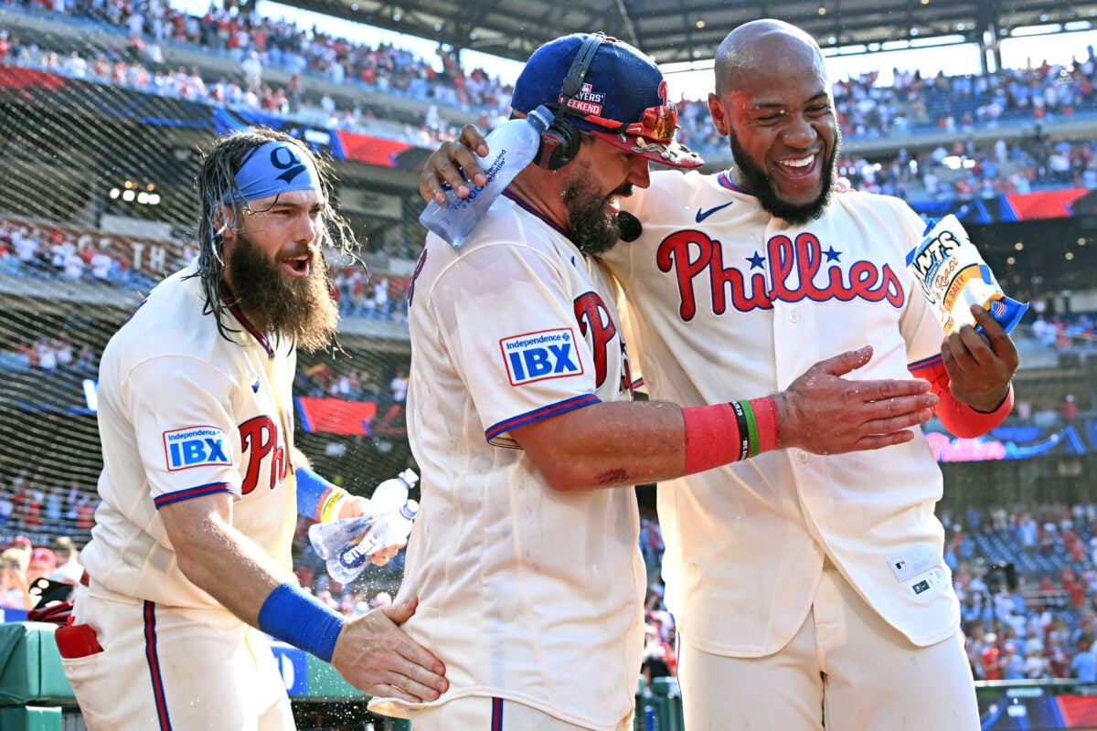 Aug 23, 2026; Philadelphia, Pennsylvania, USA; Philadelphia Phillies designated hitter Kyle Schwarber (12) celebrates his walk-off home run in the ninth inning with left fielder Brandon Marsh (16) and right fielder Bryan de la Cruz (41) against the St. Louis Cardinals at Citizens Bank Park. Mandatory Credit: Eric Hartline-Imagn Images