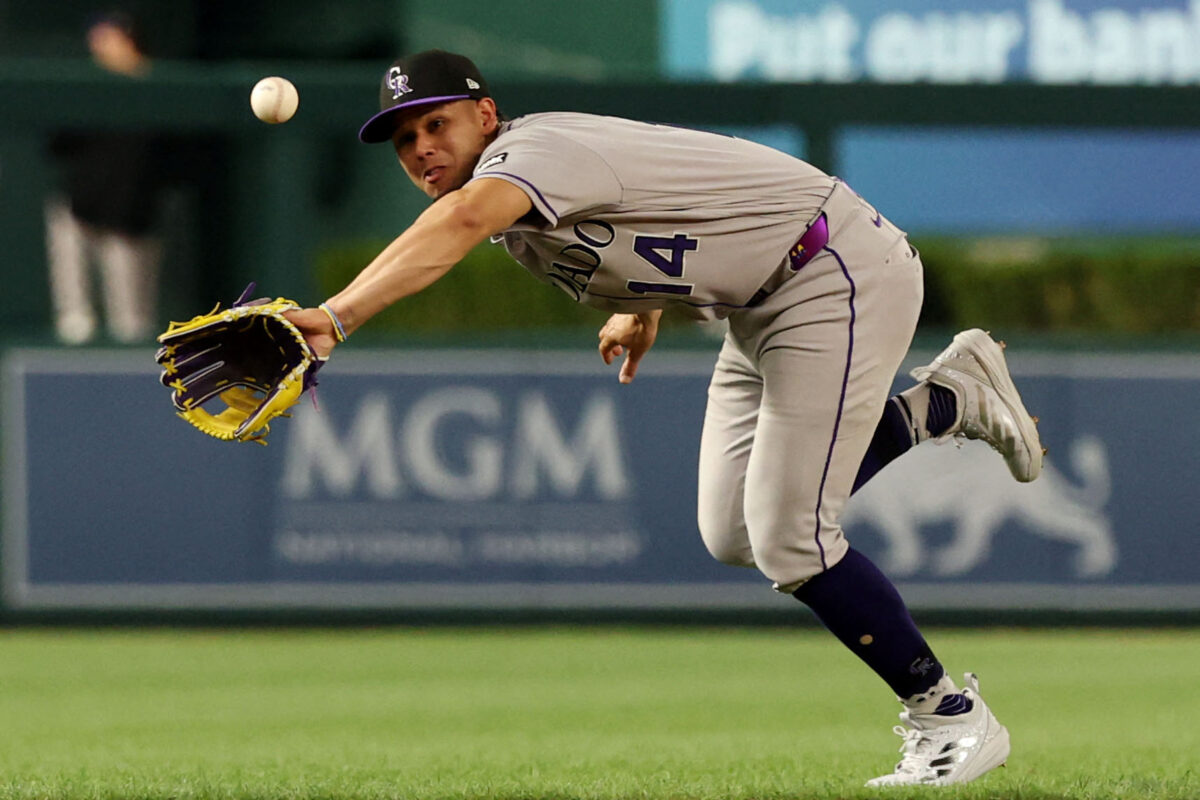 Aug 24, 2026; Washington, District of Columbia, USA; Colorado Rockies shortstop Ezequiel Tovar (14) attempts to catch a ball hit by Washington Nationals outfielder Jacob Young (not pictured during the fifth inning at Nationals Park. Mandatory Credit: Geoff Burke-Imagn Images
