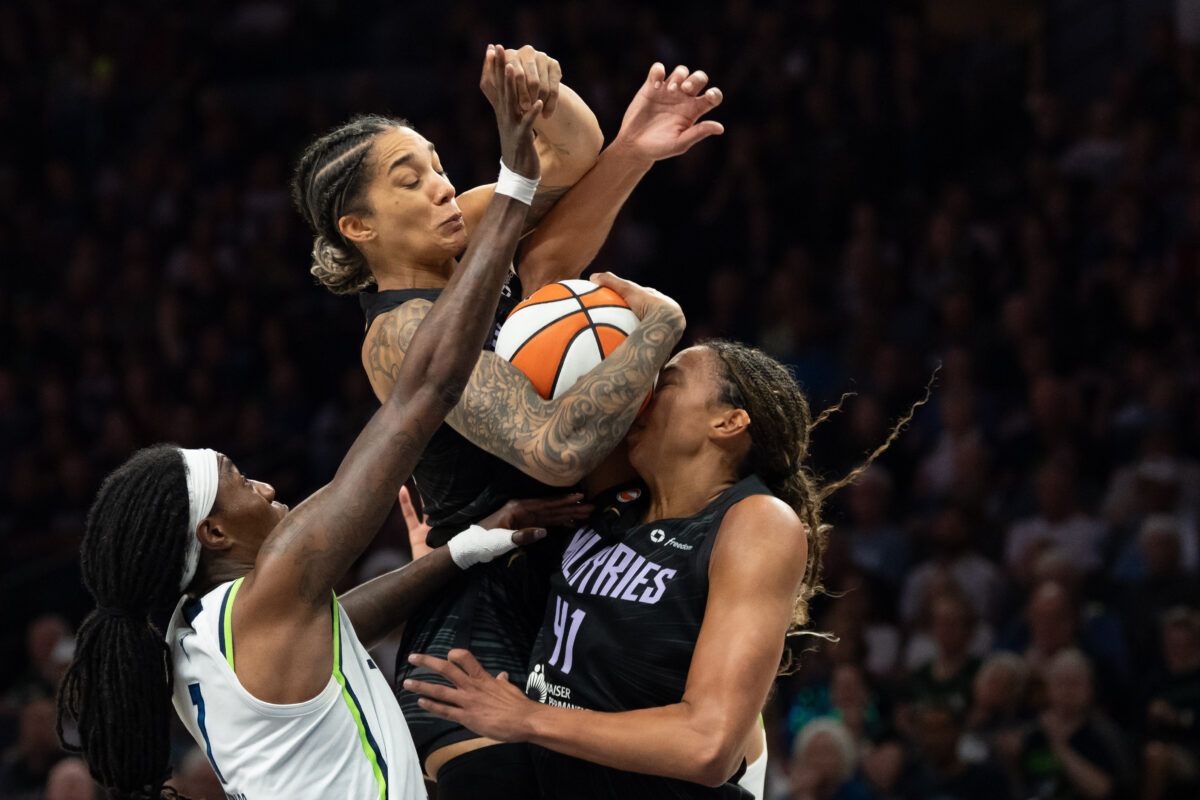 Aug 24, 2026; Minneapolis, Minnesota, USA;  Golden State Valkyries forward Gabby Williams (1) jumps fora rebound over Minnesota Lynx forward Natasha Howard (1) and Golden State Valkyries center Kiah Stokes (41) in the second half at Target Center.  Mandatory Credit: Jesse Johnson-Imagn Images