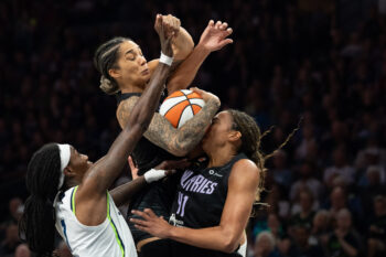 Aug 24, 2026; Minneapolis, Minnesota, USA;  Golden State Valkyries forward Gabby Williams (1) jumps fora rebound over Minnesota Lynx forward Natasha Howard (1) and Golden State Valkyries center Kiah Stokes (41) in the second half at Target Center.  Mandatory Credit: Jesse Johnson-Imagn Images