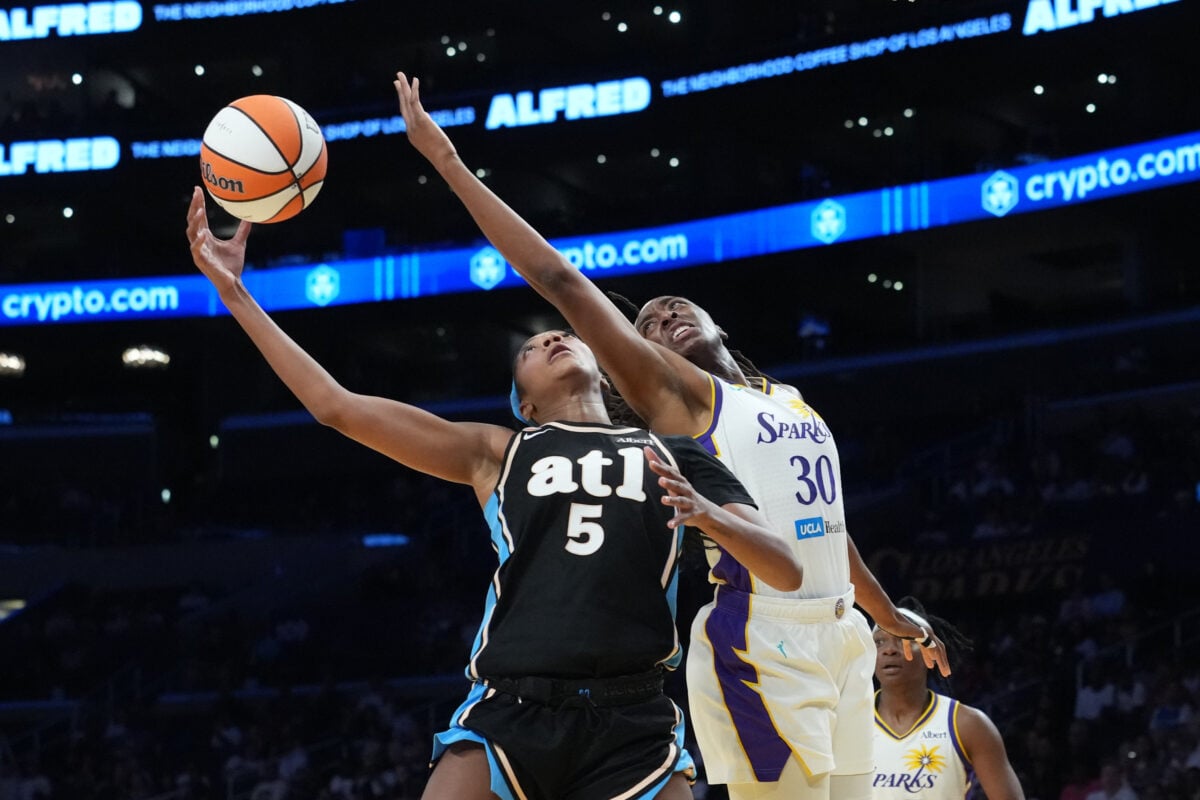 Aug 24, 2026; Los Angeles, California, USA; Atlanta Dream forward Angel Reese (5) shoots the ball against LA Sparks forward Nneka Ogwumike (30) in the first half at Crypto.com Arena. Mandatory Credit: Kirby Lee-Imagn Images