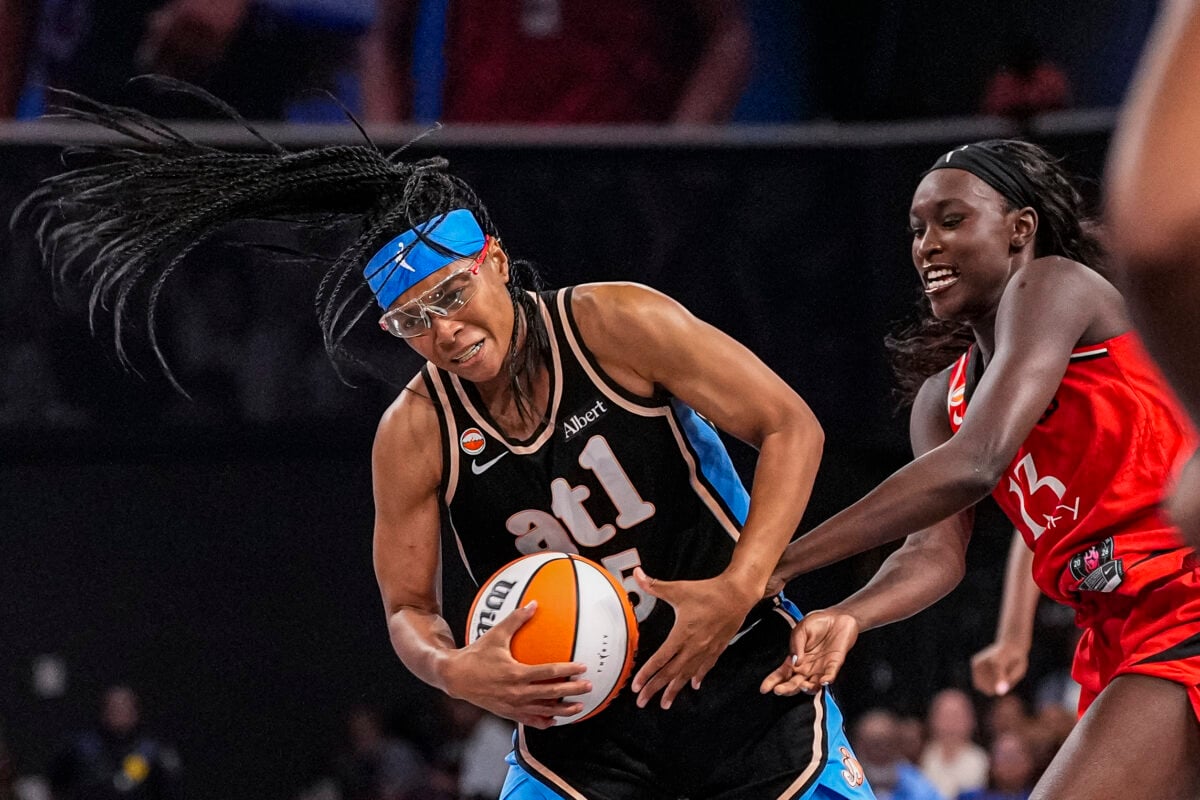 Aug 28, 2026; College Park, Georgia, USA; Atlanta Dream guard Allisha Gray (15) and Portland Fire forward Nyadiew Puoch (13) fight for the ball during the second half at Gateway Center Arena at College Park. Mandatory Credit: Dale Zanine-Imagn Images