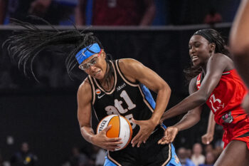 Aug 28, 2026; College Park, Georgia, USA; Atlanta Dream guard Allisha Gray (15) and Portland Fire forward Nyadiew Puoch (13) fight for the ball during the second half at Gateway Center Arena at College Park. Mandatory Credit: Dale Zanine-Imagn Images